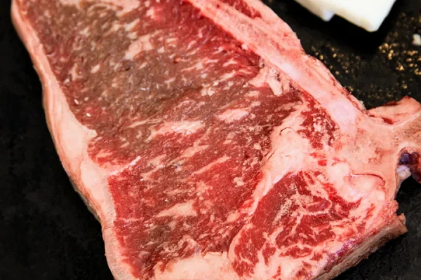 Close up picture of beef in a frying pan