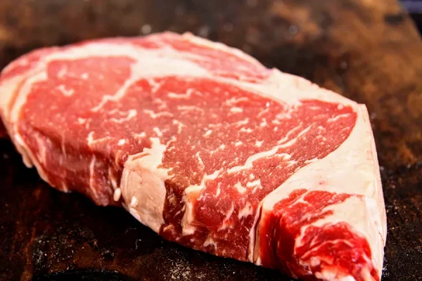 Close up picture of beef on a cutting board