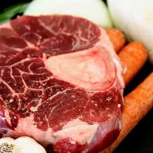 Picture of beef surrounded by vegetables